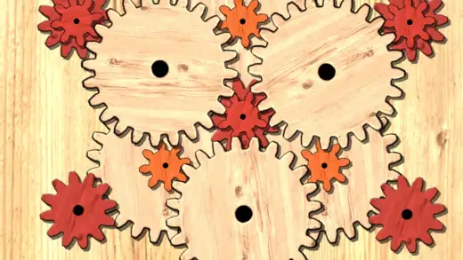 Ingranaggi di legno colorati incastrati fra loro nel gioco Gears logic puzzles